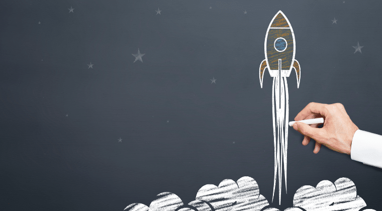 man drawing rocket launching on a chalkboard. Church Equip Curriculum How to Launch a New Church Site