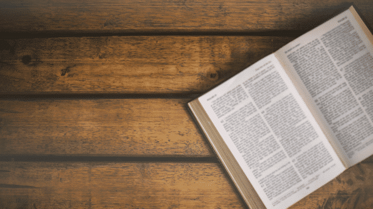 Bible open laying on brown table. Church Equip Teaching the Old Testament in Your Church Church Equip Curriculum