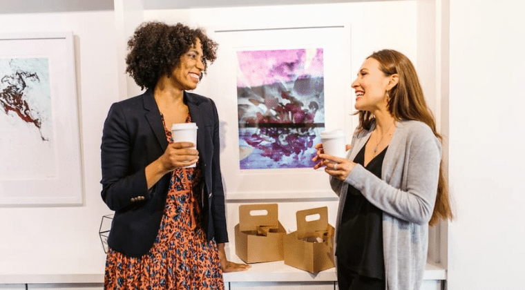 Two ladies talking and smiling holding coffee cups. Church Equip Sharing the gospel with ease Church Equip Curriculum
